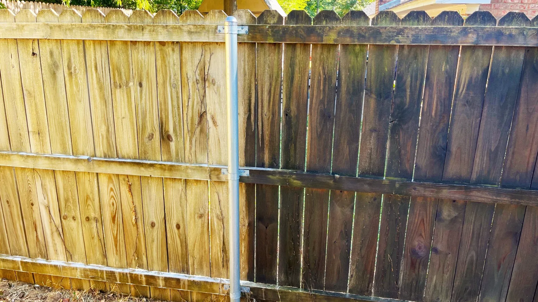 681d32af617b1_Fence Pressure Wash Comparison A fence that has been stained and cleaned.