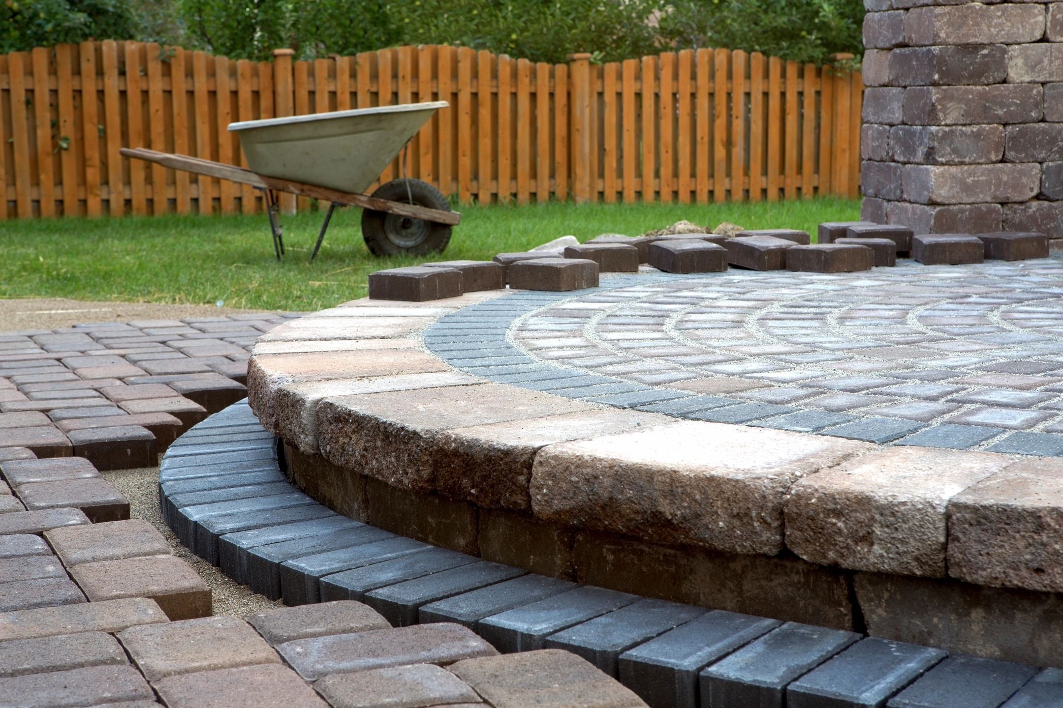 fm=f_5019 A brick patio with a circular design in the middle of it.
